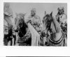 image of Three Indians on horses watching a roundup